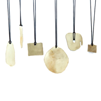 Rocks Collection. Vintage Brass pendants on silk cord with shapes inspired by the rock formations at Joshua Tree.