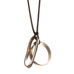 Love Collection. Nickel over steel with silk cord. Pendant available in different sizes.