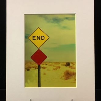 End. Colorful photo printed with metallic ink, creating an almost 3-D effect. Photo taken in Salton Sea, CA.