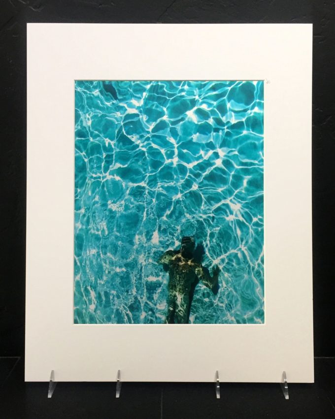 Weems in Pool. Colorful photo printed with metallic ink, creating an almost 3-D effect.
